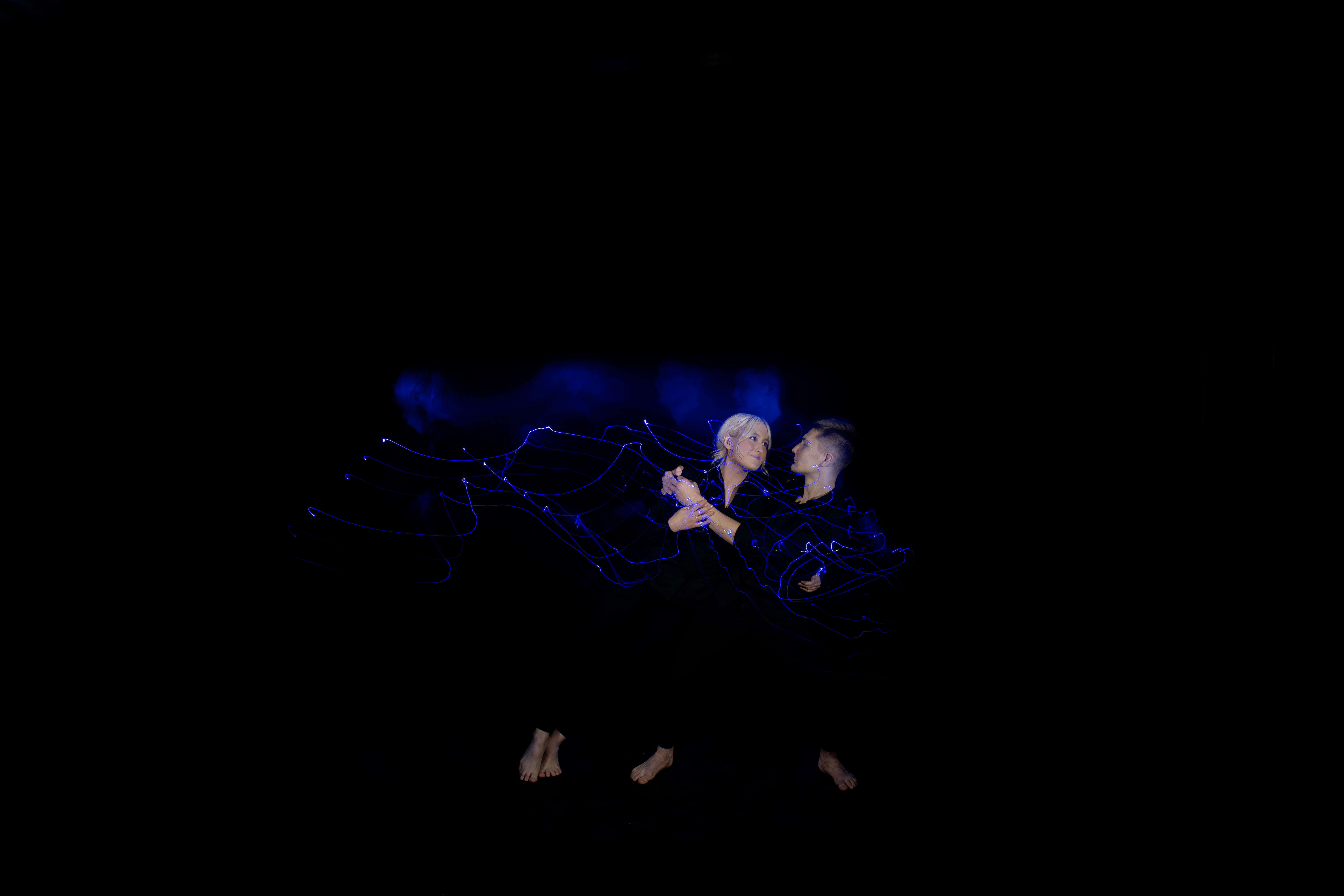 two dancers in studio with special lighting affects 