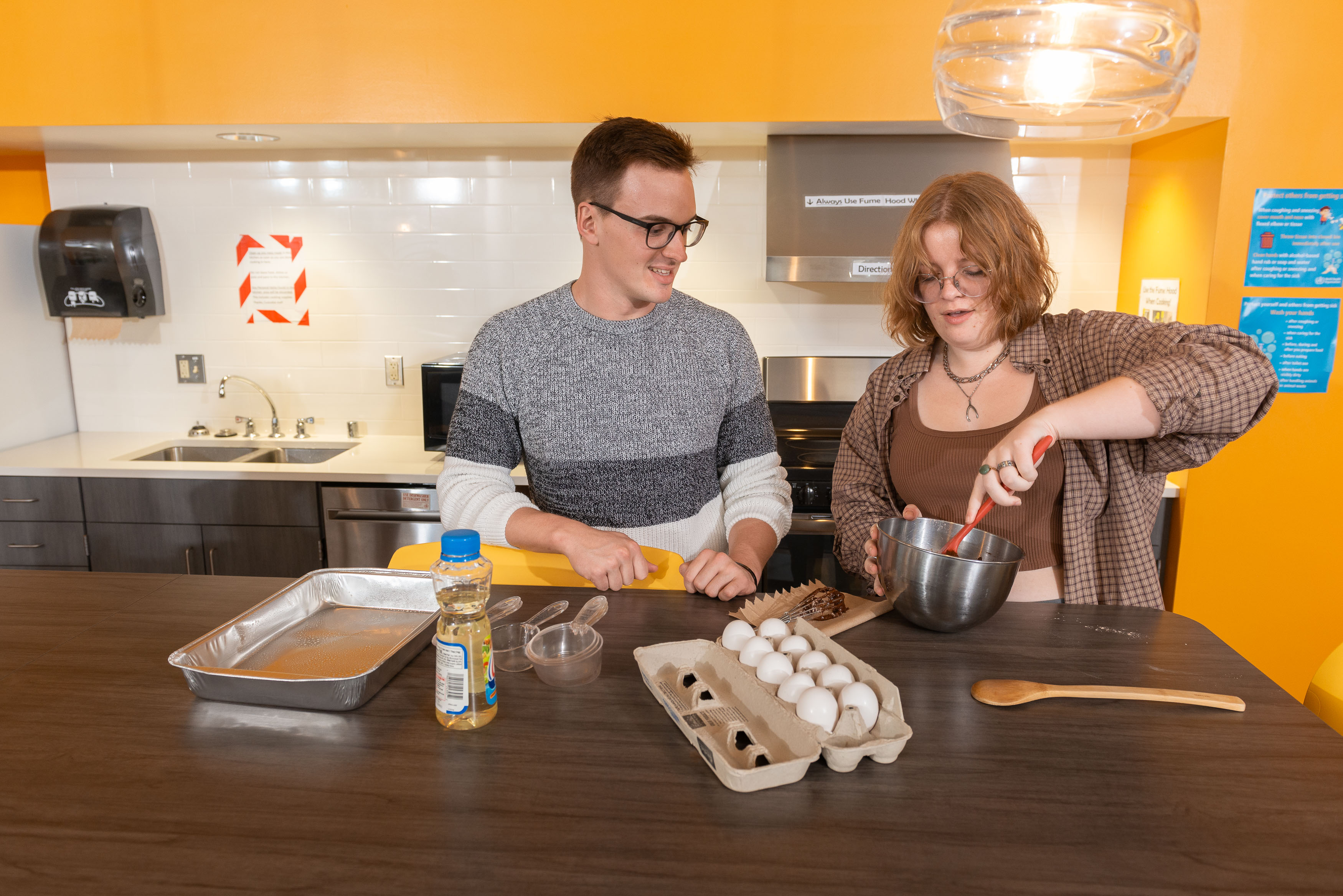 Students making cookies in The Suites residence hall.