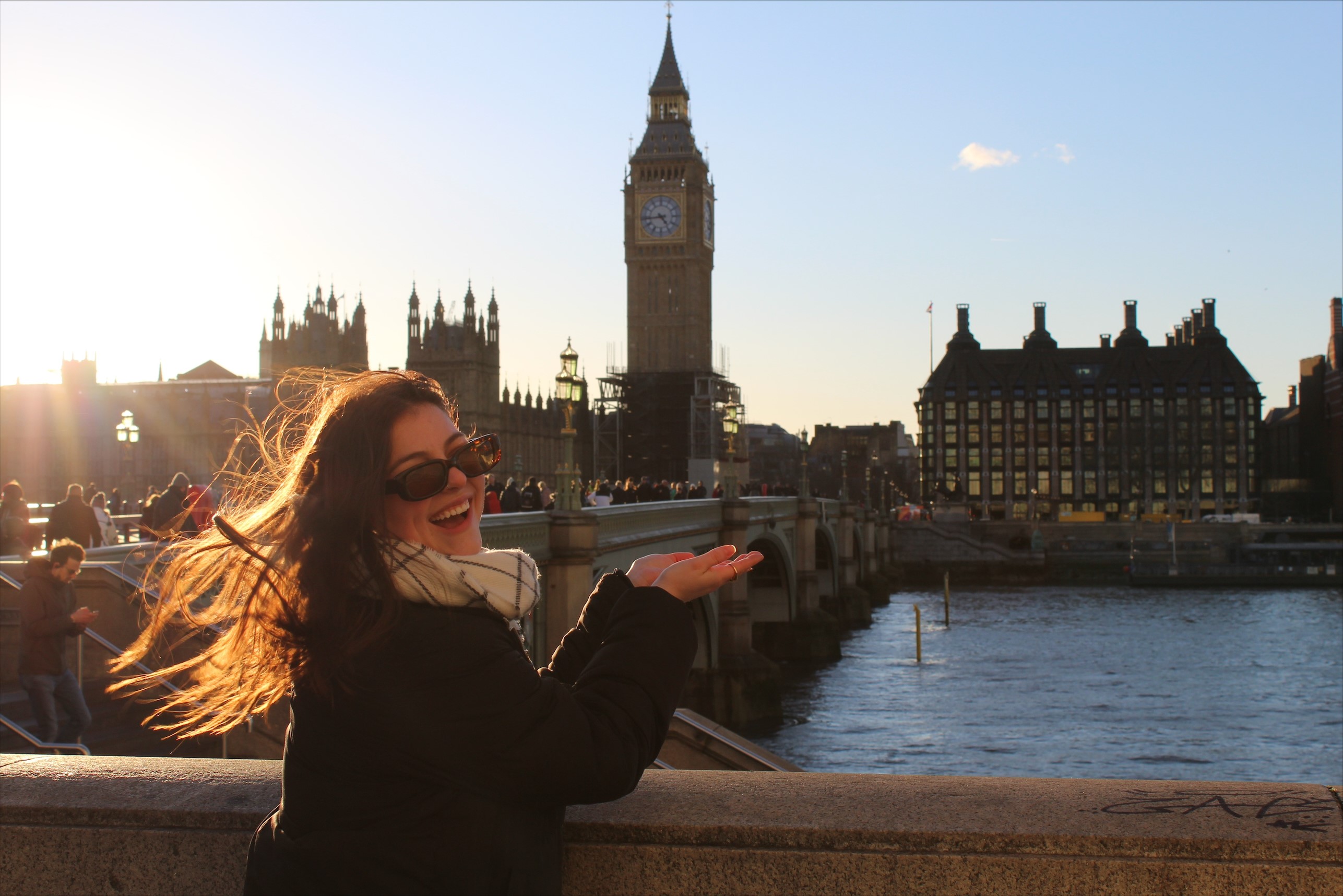 A student on a study abroad program in England, Winchester taking picture with Big Ben tower