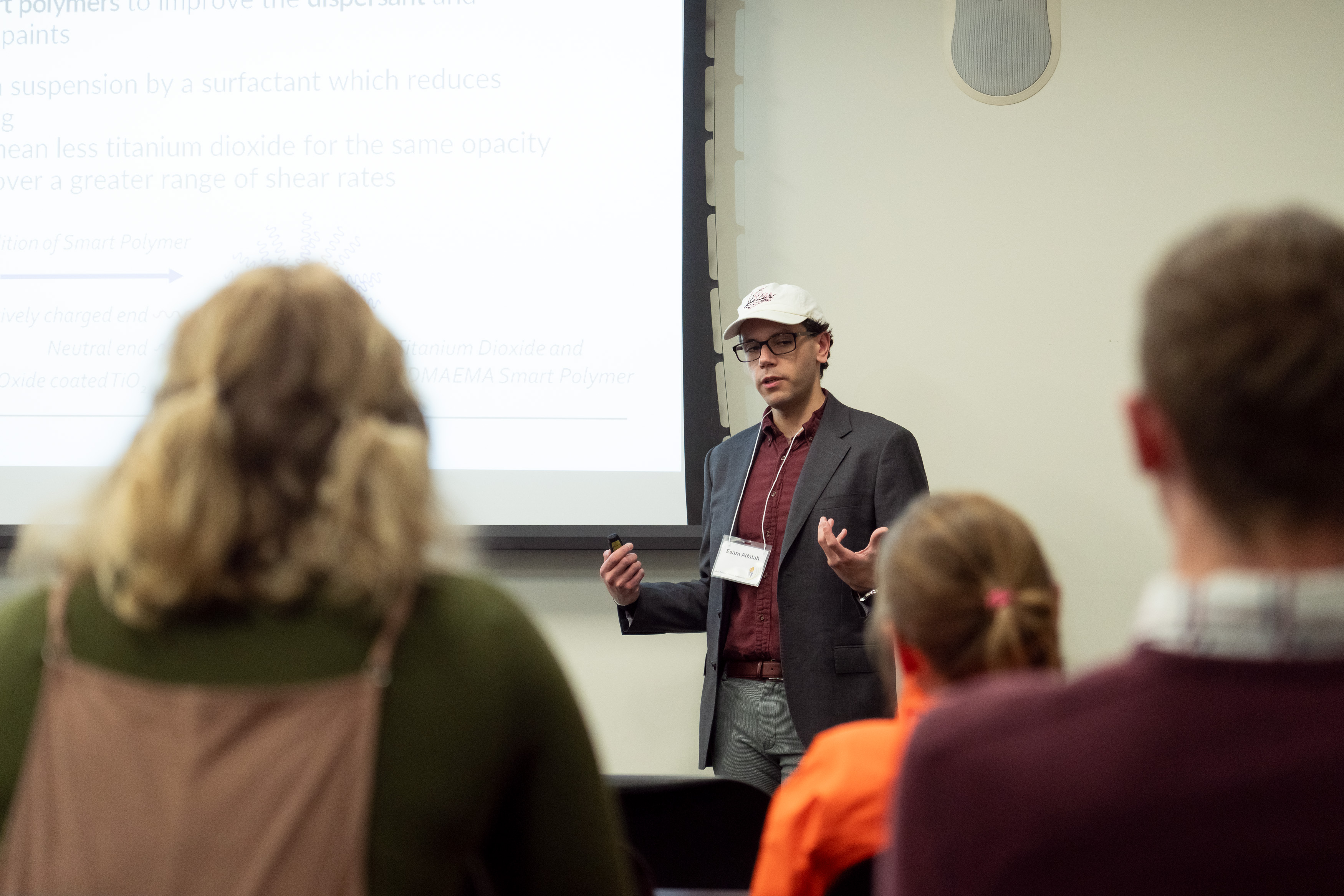 a student presents at the front of the room