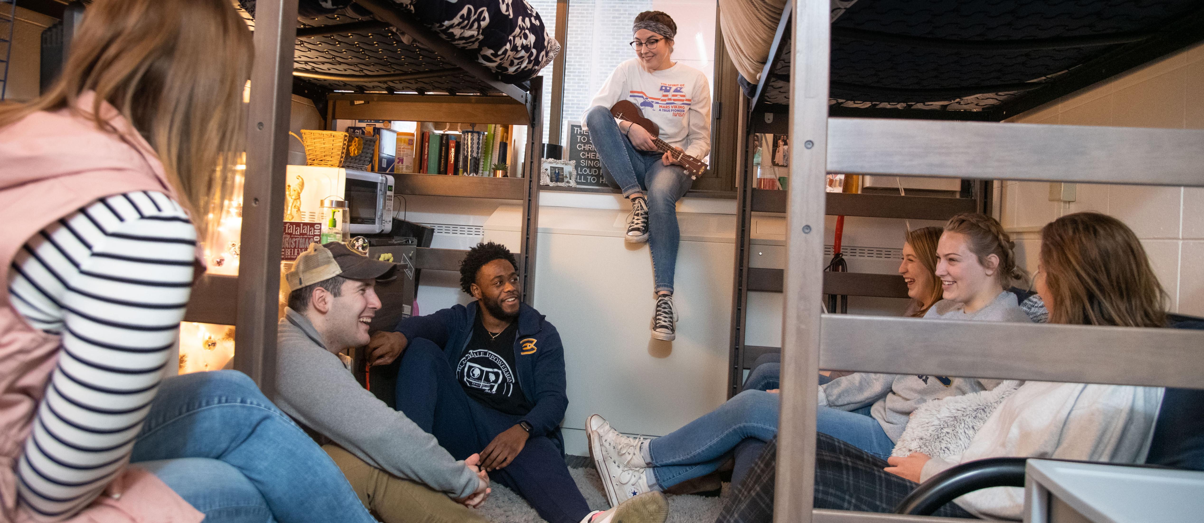 Students hanging out in residence hall room