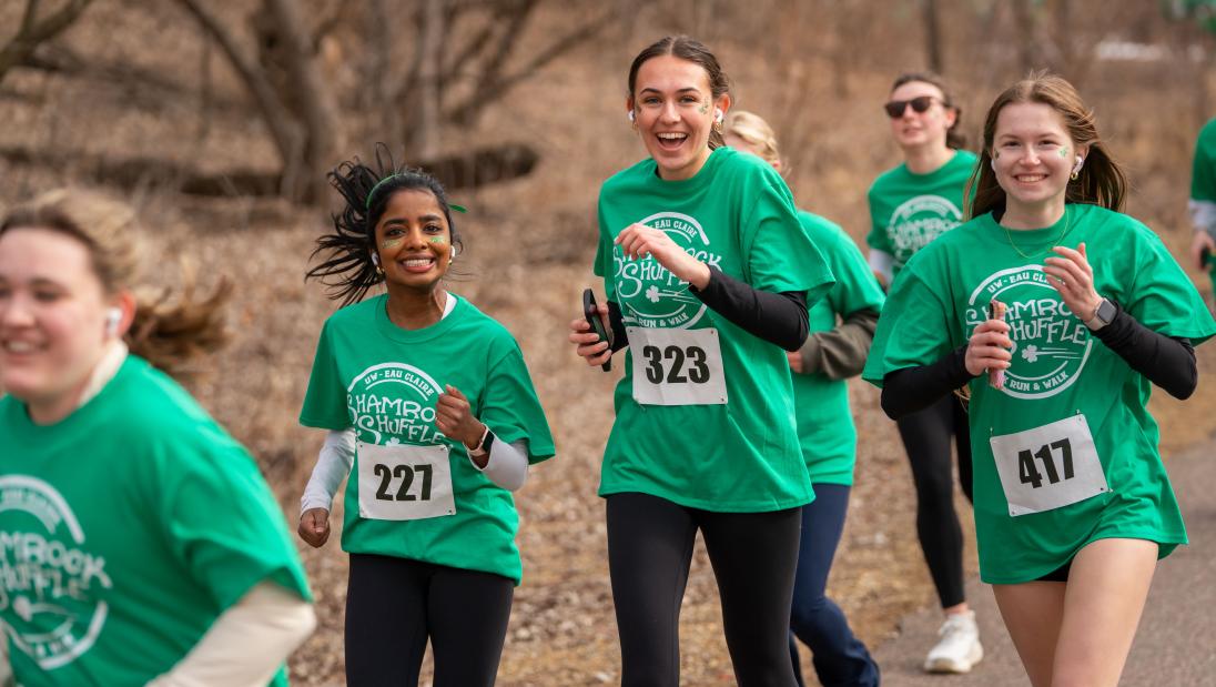 Group of girls smiling and running