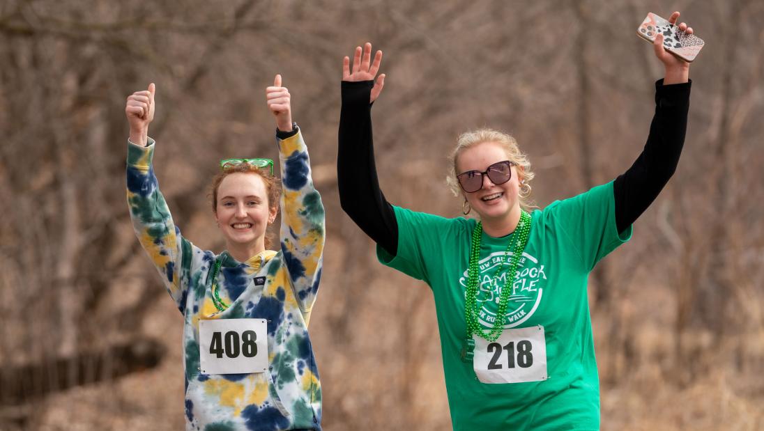 Two girls running and cheering