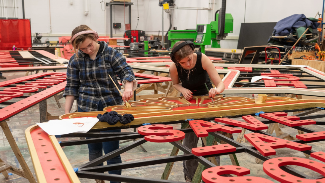 Scene Shop students painting props for the Guys and Dolls production