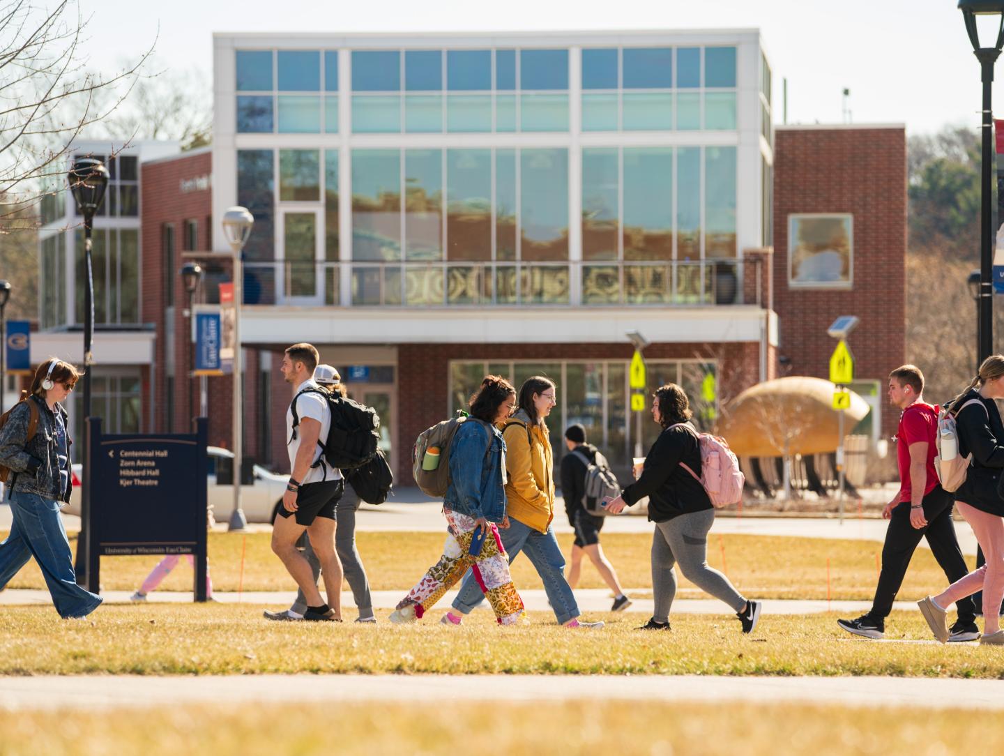 campus scene fall , students passing on the mall 