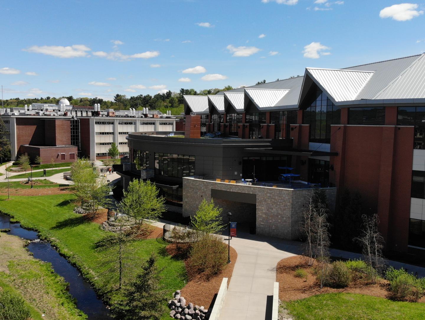 Aerial view of Davies Center and creek, no people 