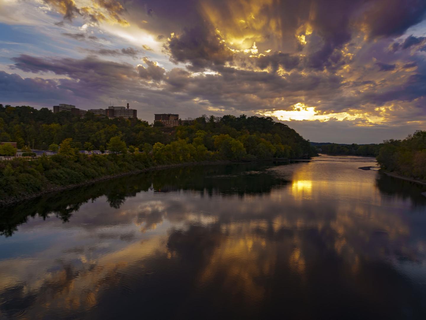 A fall sunset over the Chippewa River as seen from the footbridge.