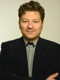 Photograph of Dr. Krichevsky in grey shirt and blue blazer