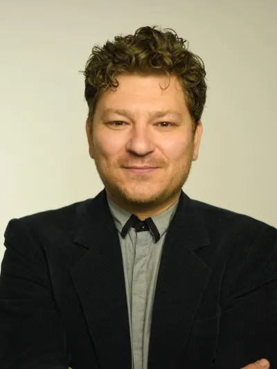 Photograph of Dr. Krichevsky in grey shirt and blue blazer