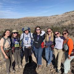 Alaina and classmates pose for the camera while out in the field.