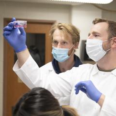 Zach Caterer (left) will present the undergraduate student research he is doing with Dr. Michael Walsh (right) during the Research in the Rotunda event in March in Madison. (Photo by Shane Opatz)