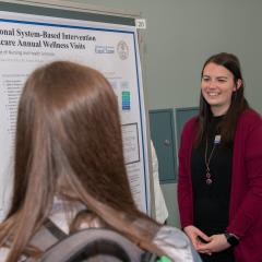 Grad student presents research poster