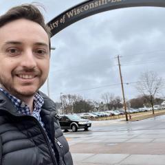 Andre poses in front of the UW-Eau Claire arch on Garfield Ave.