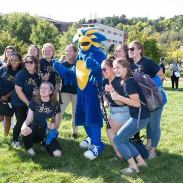 BMB students with Blu on the mall grass 