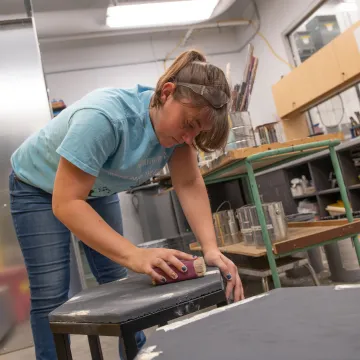 Student working in the scene shop at the Pablo Center