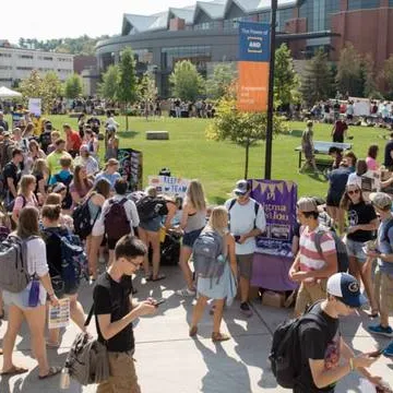 Students participating in an organization fair outside