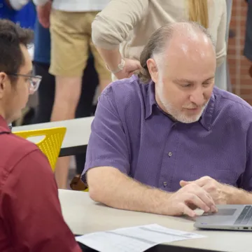 a faculty member works with a student