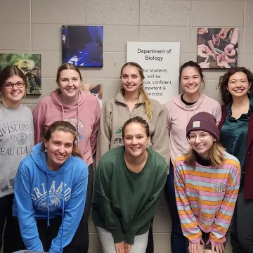 Small group of student researchers smiling