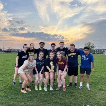 Intramural soccer team poses with their trophy