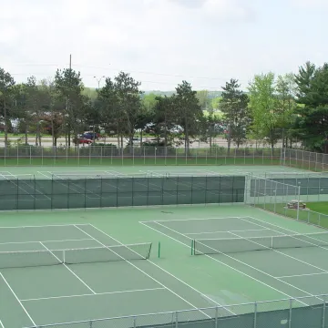 Upper campus tennis courts behind McPhee