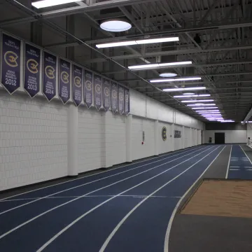 Indoor track with sandpit