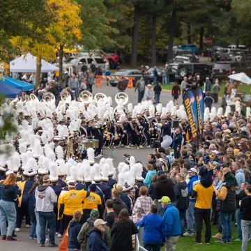 BMB plays for alumni tent at Carson Park for HOCO 