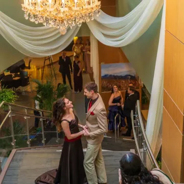 Couple on grand staircase at Viennese Ball