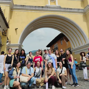 group of students posing in a city center in Guatemala