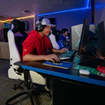 Students gaming in the Esports room.