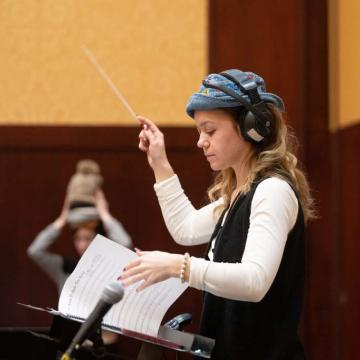 student conducting rehearsal