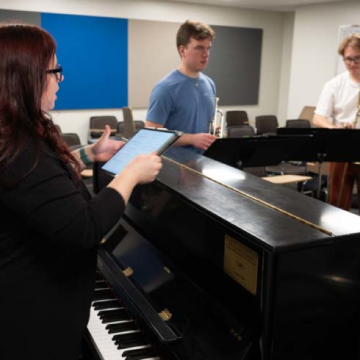 Composer and Alumni Heidi Joosten working with students in Haas