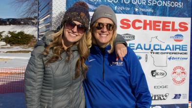 Sheryl Poirier at major signage for JigsUp sponsorships