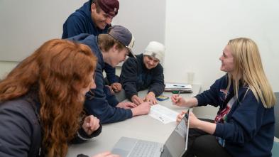 Marketing students working together on project in the IMC course.