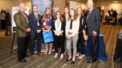 A group of people gather for a photo at the 2022 CHAASE Health Care Administration Annual Banquet
