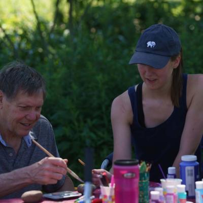 student working with aphasia patient at CSD garden 