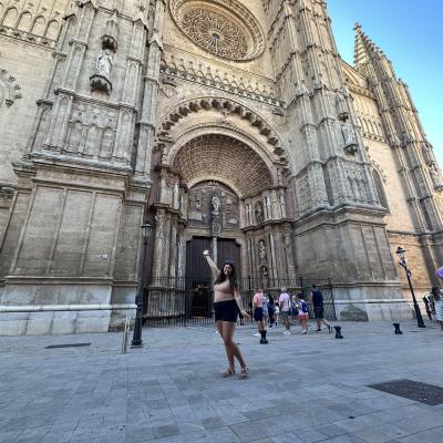 female student posing in front of Italian cathedral 