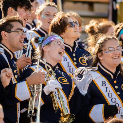 A picture of Blugold marching band with cheerful energy