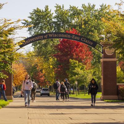 students under the archway at UWEC, fall scene