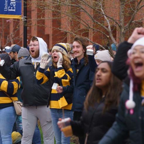 Students cheer on the runners at the end of the Eau Claire Marathon (The Blugold Mile)