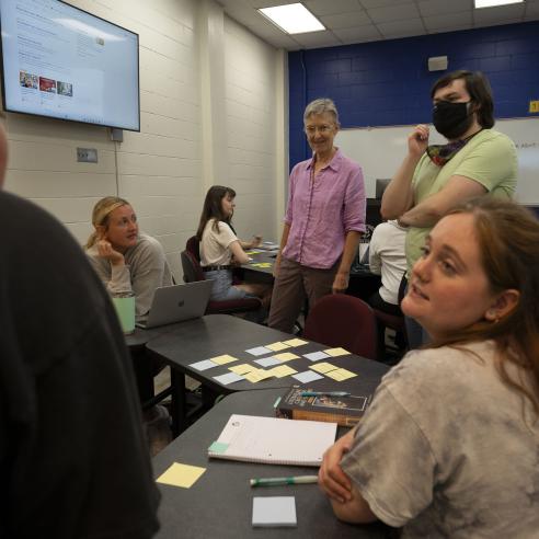 A picture of group of people discussing at English Festival