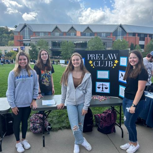 4 girls at a table for Pre-Law club at BobFest
