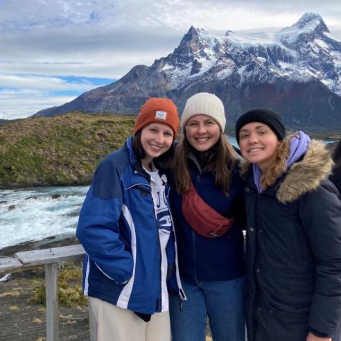 A group of student during study aboard taking picture at a Torres del Paine National Park, Chile.
