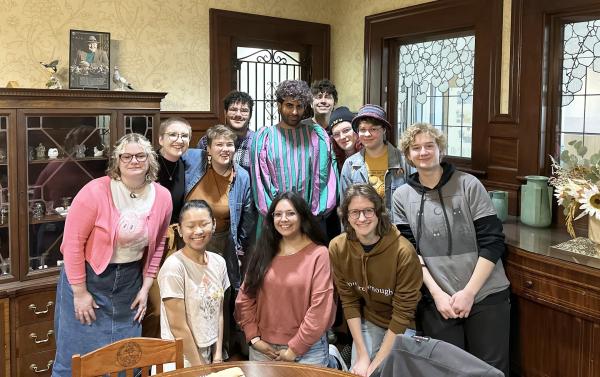 A group of people smile for the camera.