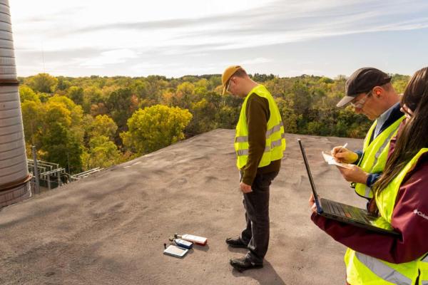 Environmental public health students and faculty on the roof of Banbury collecting data