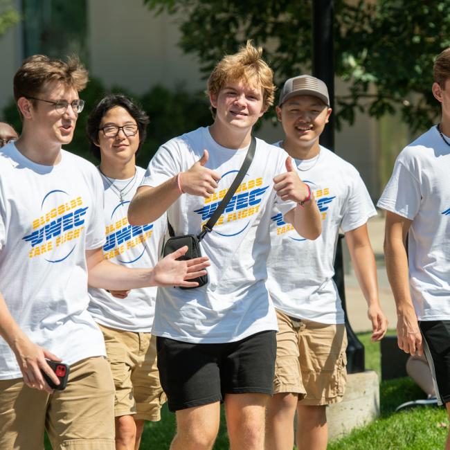 A group of first-year student participating in Freshman connection wearing UWEC merch clothes