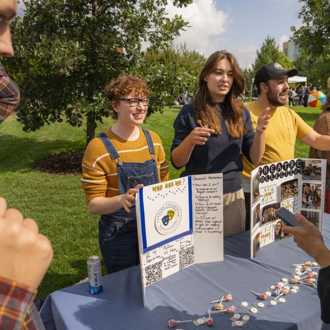 students exploring student orgs at outdoor event 