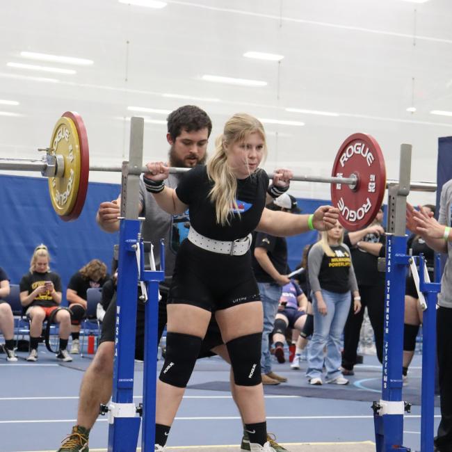 Powerlifting club student competing 