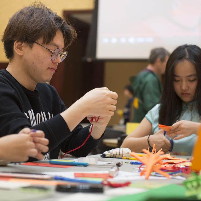 College students in Davies getting creative with crafts.