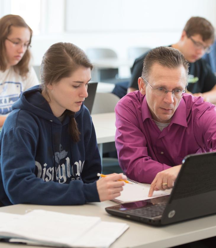 Math instructor working with a student 