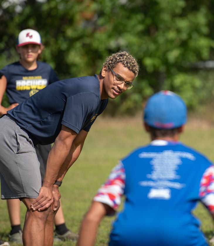 Blugold coaching student with youth players